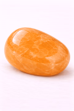 Orange Calcite, a polished specimen